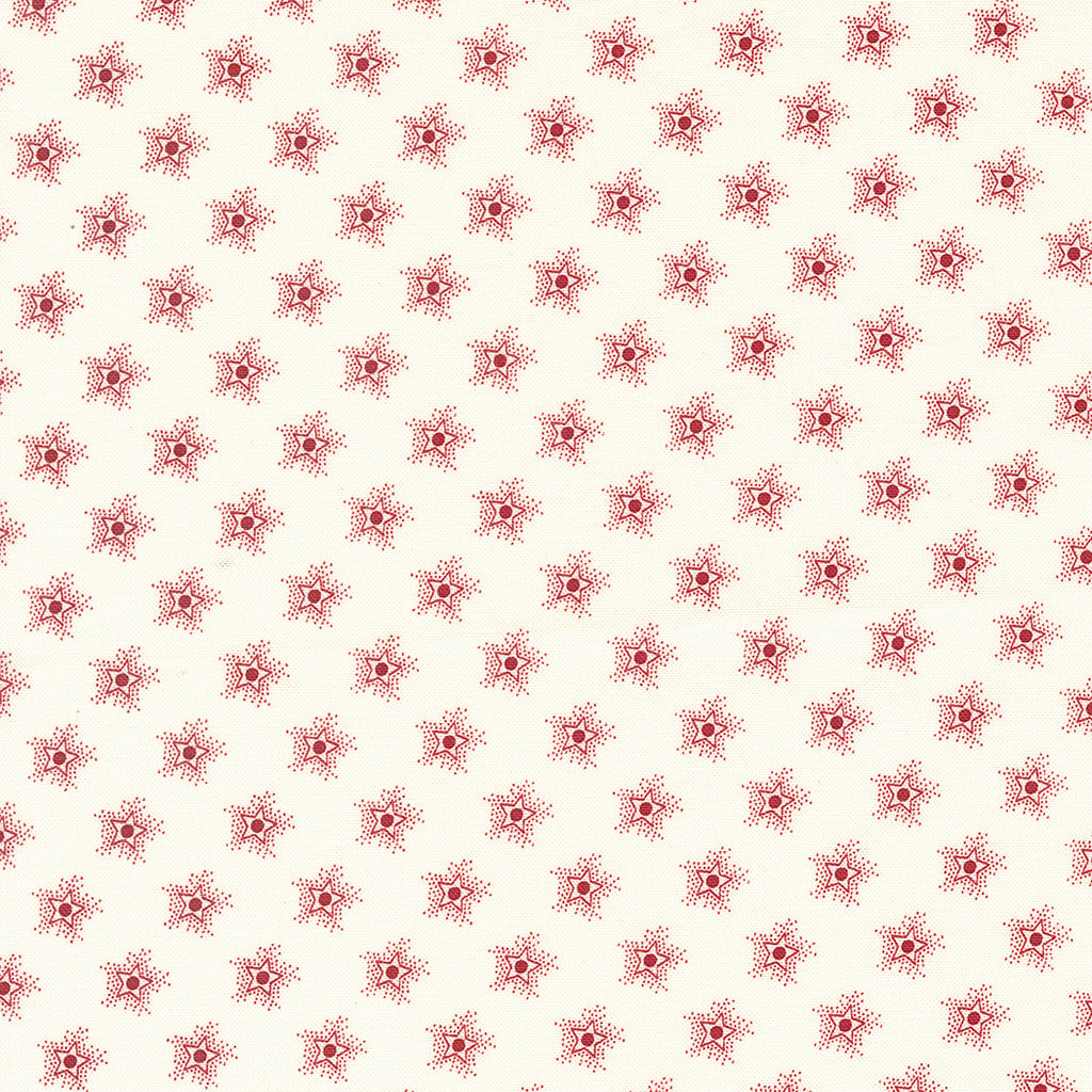 Red stars on a white background.  Fabric