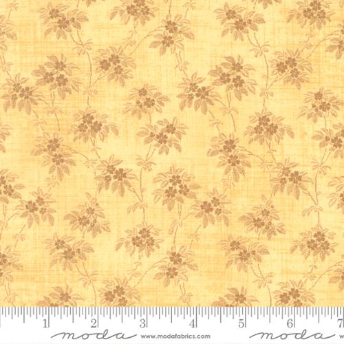 Light brown and tan florals on a buttery yellow background. Fabric