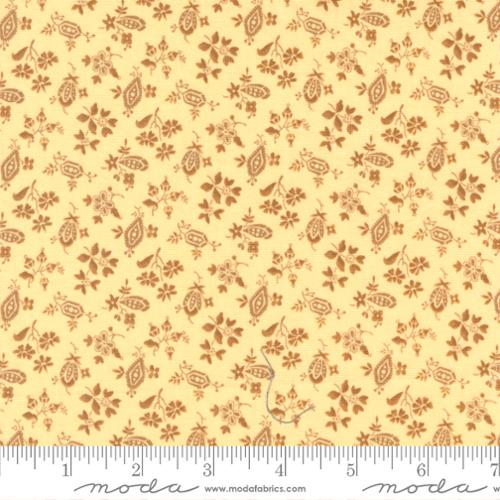 Reddish brown florals and leaves on a buttery yellow background. Fabric