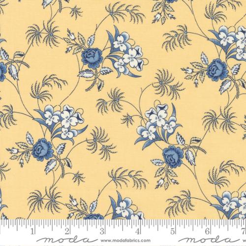 Traditional blue and white floral print on a butter yellow background. Fabric