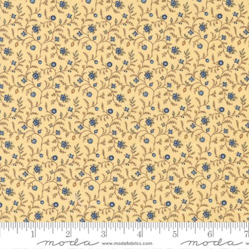 Traditional small blue and tan floral pattern on a butter yellow background. Fabric
