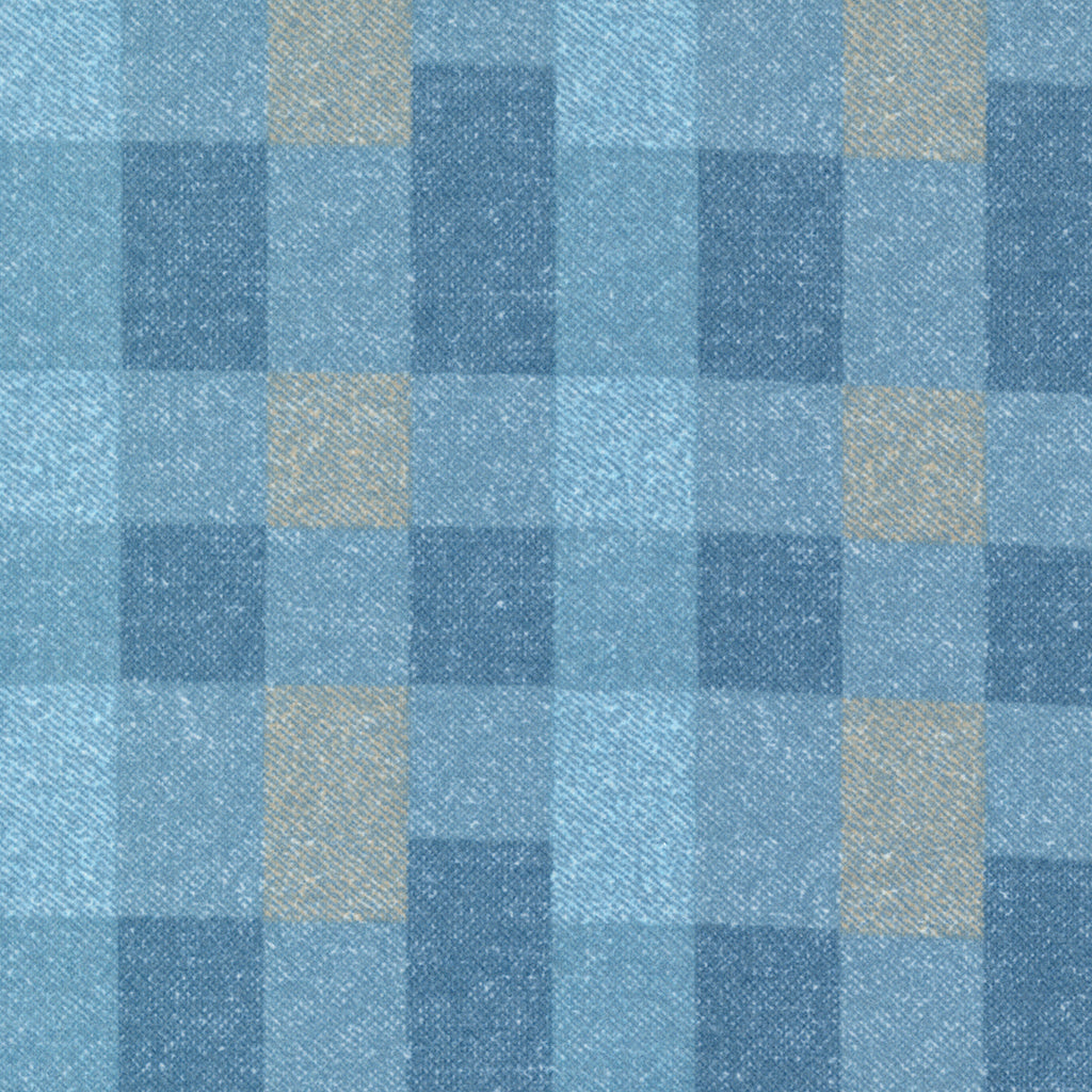 Large block plaid fabric done in a medium blue, light blue, and cream color way.
