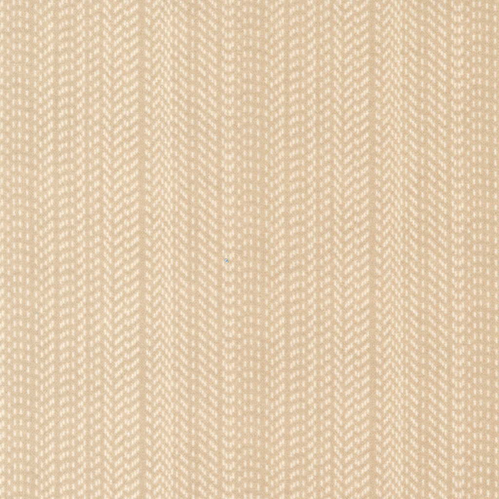 Sandy tan flannel fabric with cream stripes.