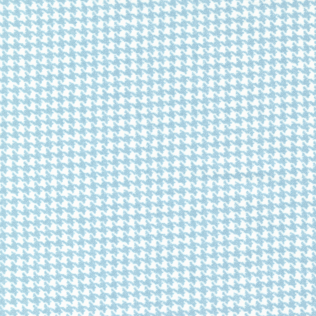 Houndstooth plaid done in light blue and white. Fabric