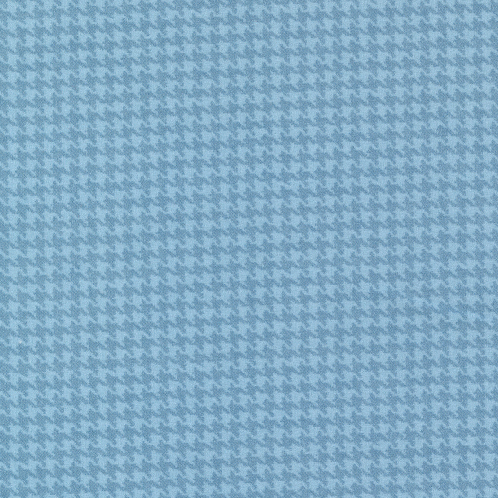 Houndstooth plaid done in medium and light blue. Fabric