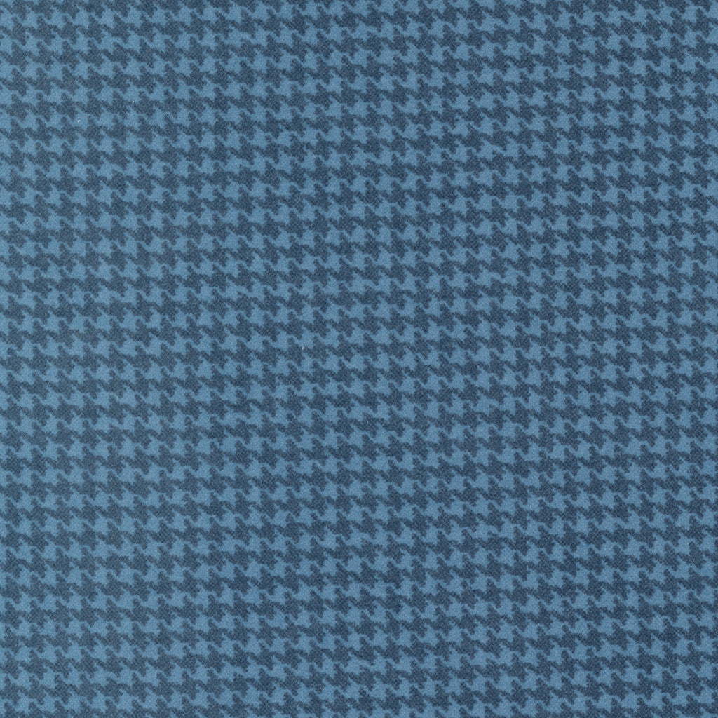 Houndstooth plaid done in medium and dark blue. Fabric