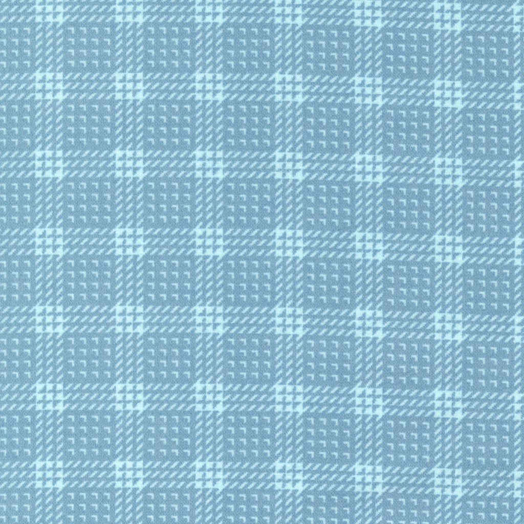 Striped and checked plaid done in medium and light blue. Fabric