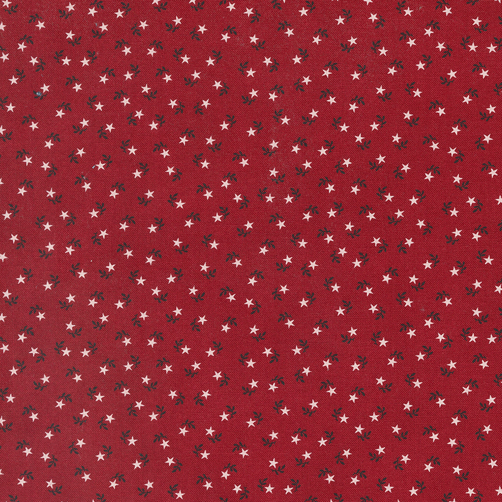 Small White Stars, looking similar to flowers, with Blue Leaves on a Red Background. Fabric