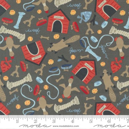 Allover print of various dog toys, dog houses, leashes, collars, and the word "Woof" on a gray background. Fabric