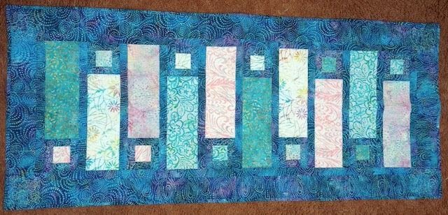 Batik table runner in Caribbean colors. 