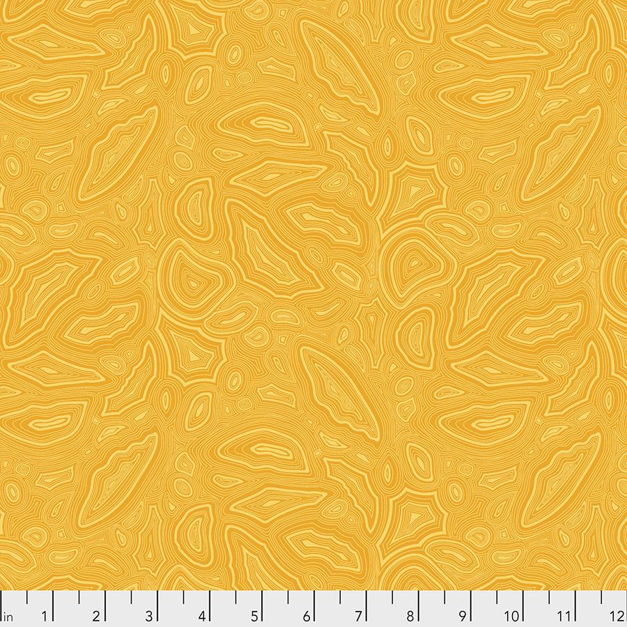 Bright lemon yellow geometric print, reminiscent of a rock or geode. Fabric