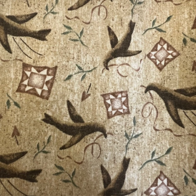 Crows and quilt blocks on a mottled tan background