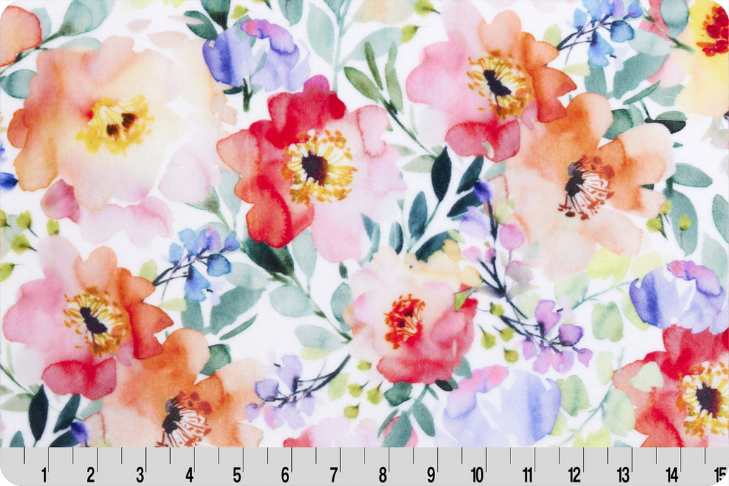 White background with multi-colored flowers in orange, purple, pink and green leaves. Cuddle Fabric