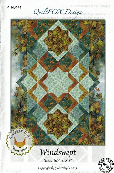 Windswept Pattern by Judit Hajdu for QuiltFOXDesign makes a 60in x 80in throw quilt. It is pictured using the Autumn Splendor fabric by Northcott.